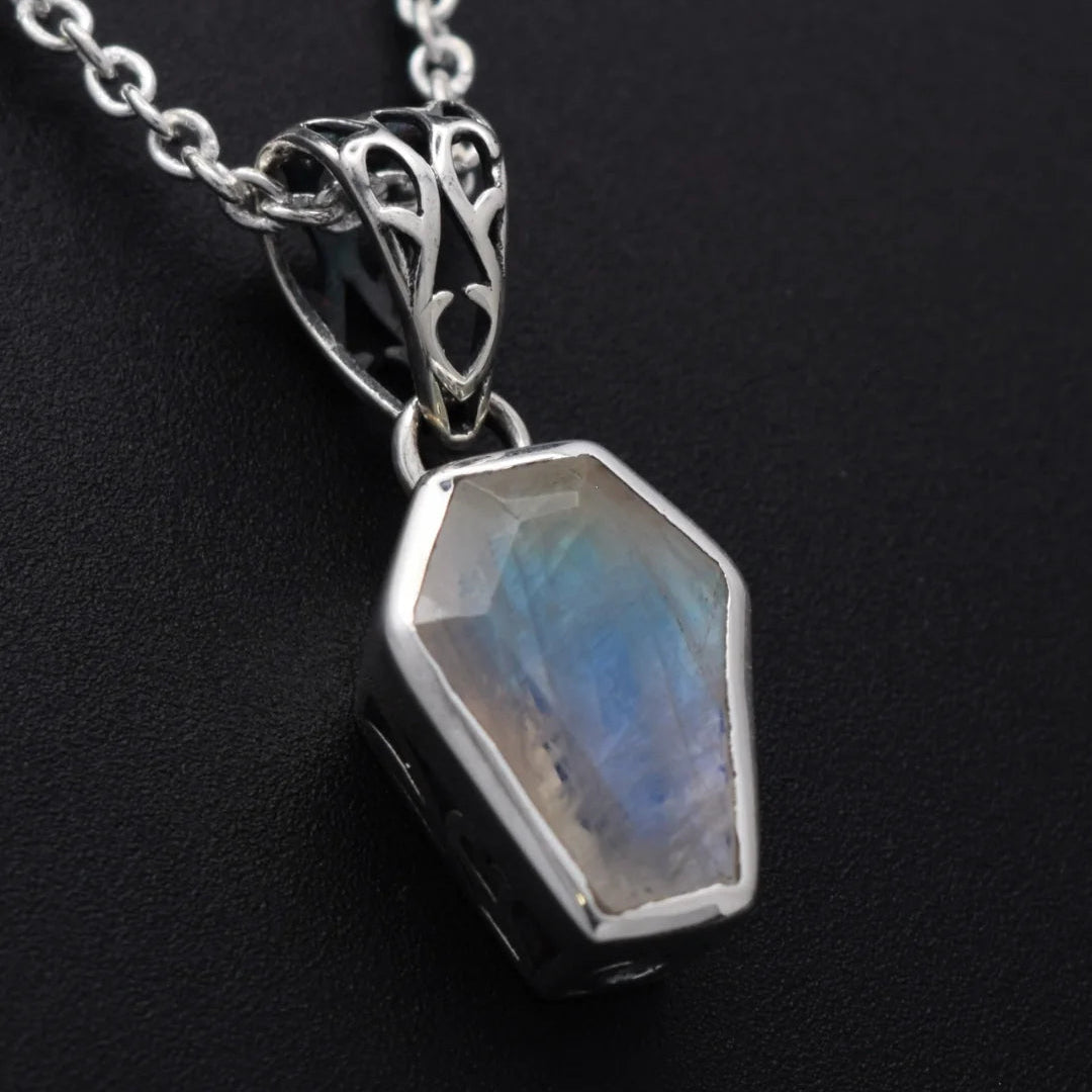 Silvaria rainbow moonstone coffin necklace, front view of the coffin-cut moonstone pendant on a silver chain