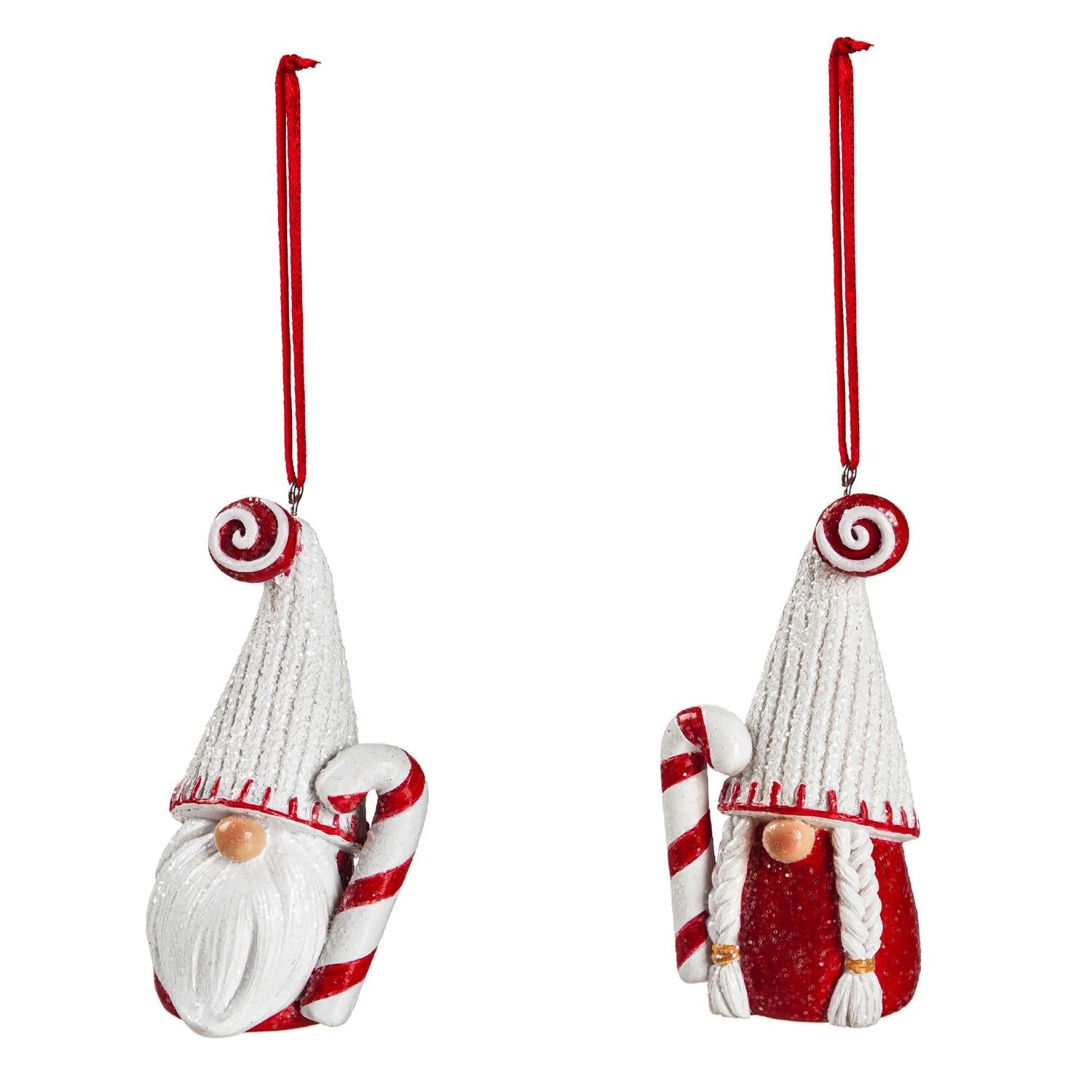 Two resin gnome Christmas ornaments in white knit hats with peppermint swirls, one bearded and one with braids, each holding a candy cane