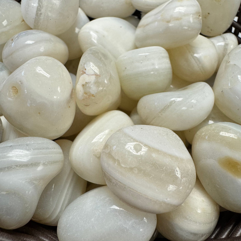 Close-up of white pebbles with a focus on texture and color.
