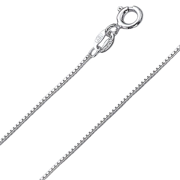 Silver necklace chain on a light gray background