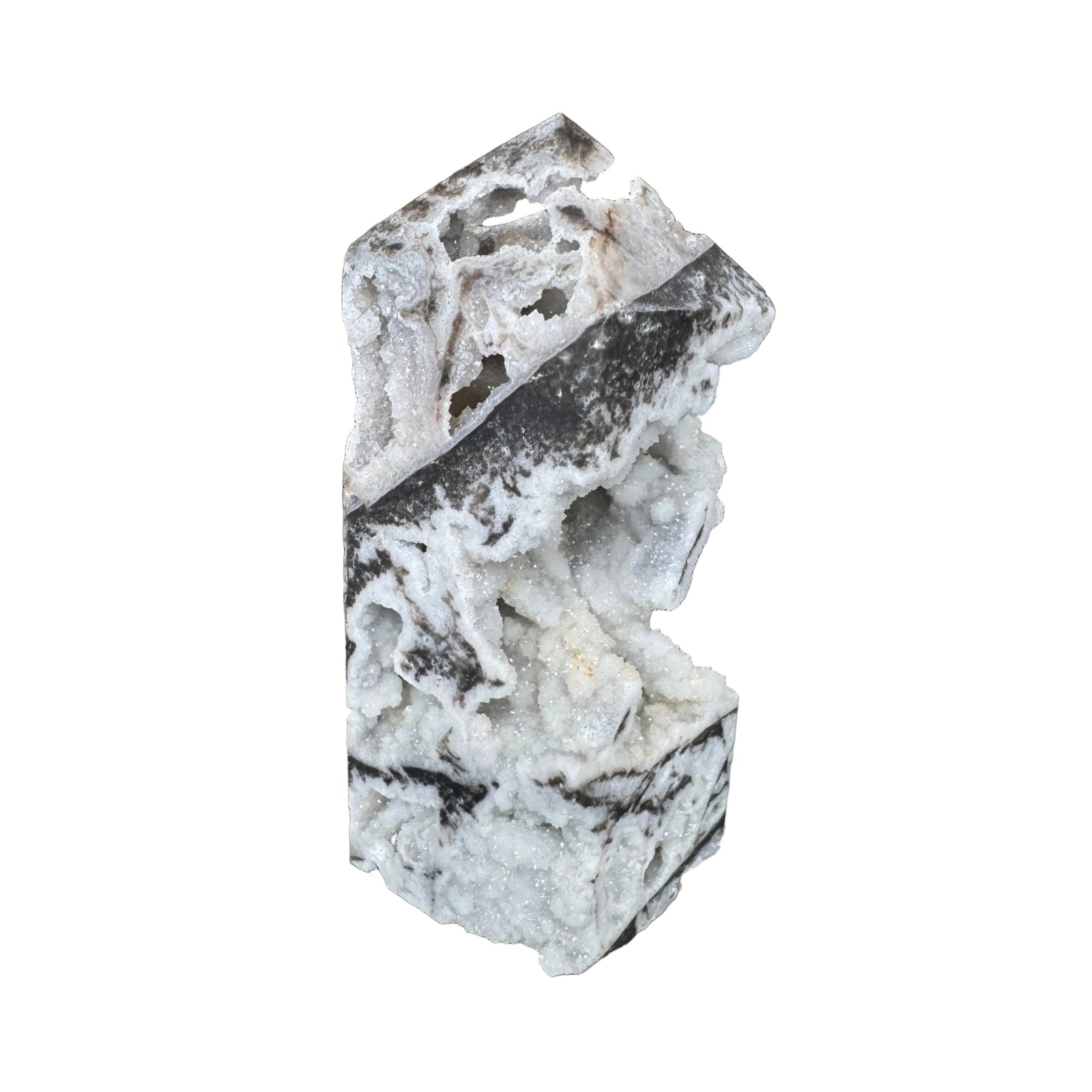 Close-up of a crystal formation with a blurred store interior in the background