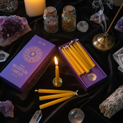 Meditation candles with packaging on a wooden surface