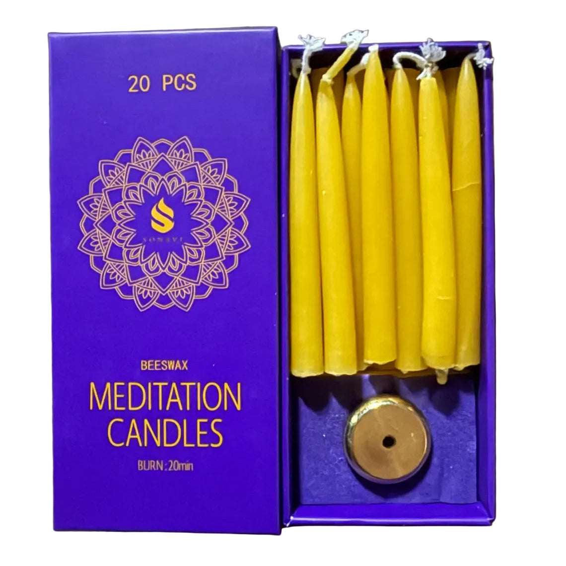 Box of meditation candles with yellow candles and a purple box on a wooden surface