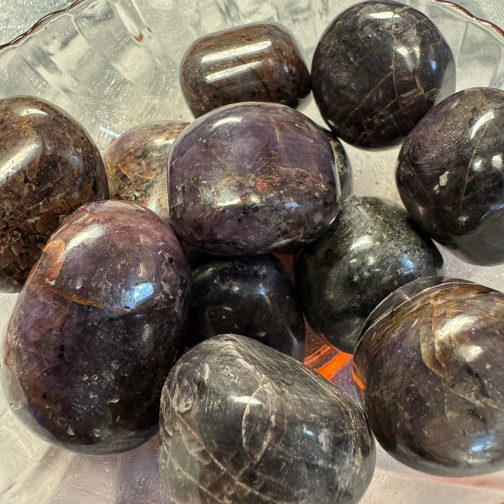 star ruby tumbled stones in a bowl