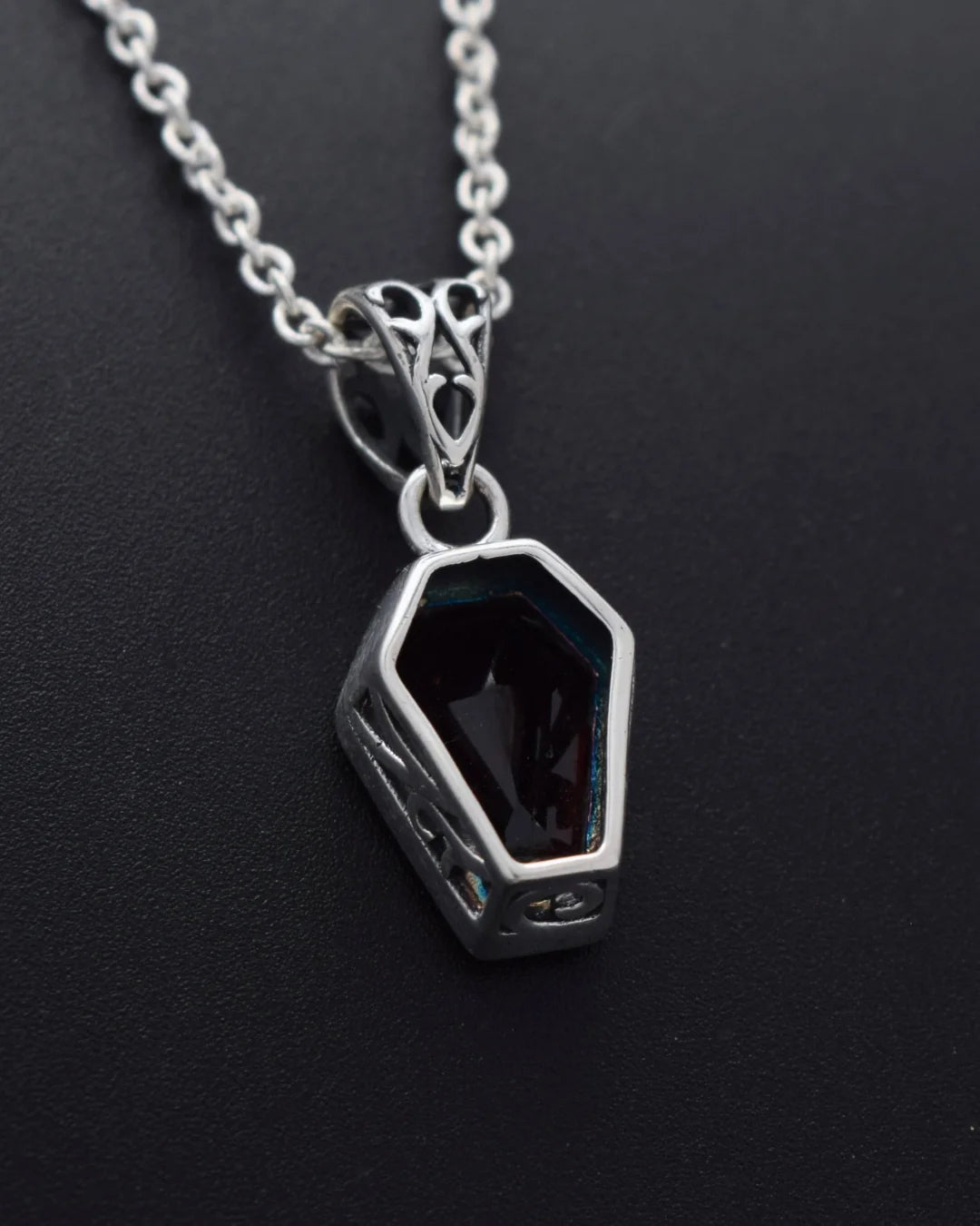 Back of the Silvaria garnet coffin pendant showing the silver setting