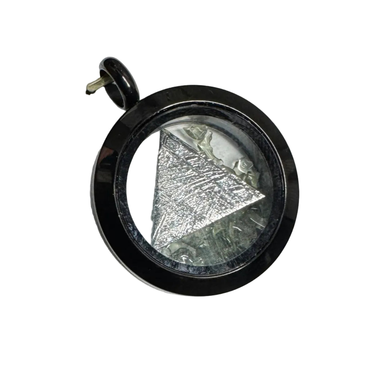 A black bezel pendant with a clear dome over a triangular meteorite specime