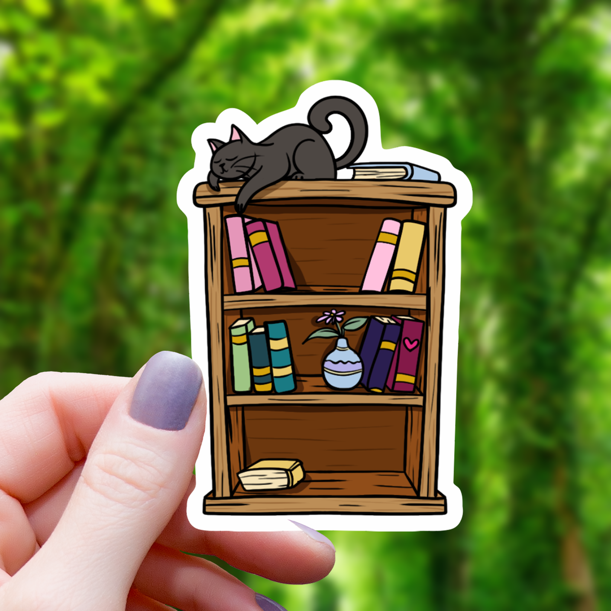 Cat Sleeping on Bookshelf Sticker - 3"