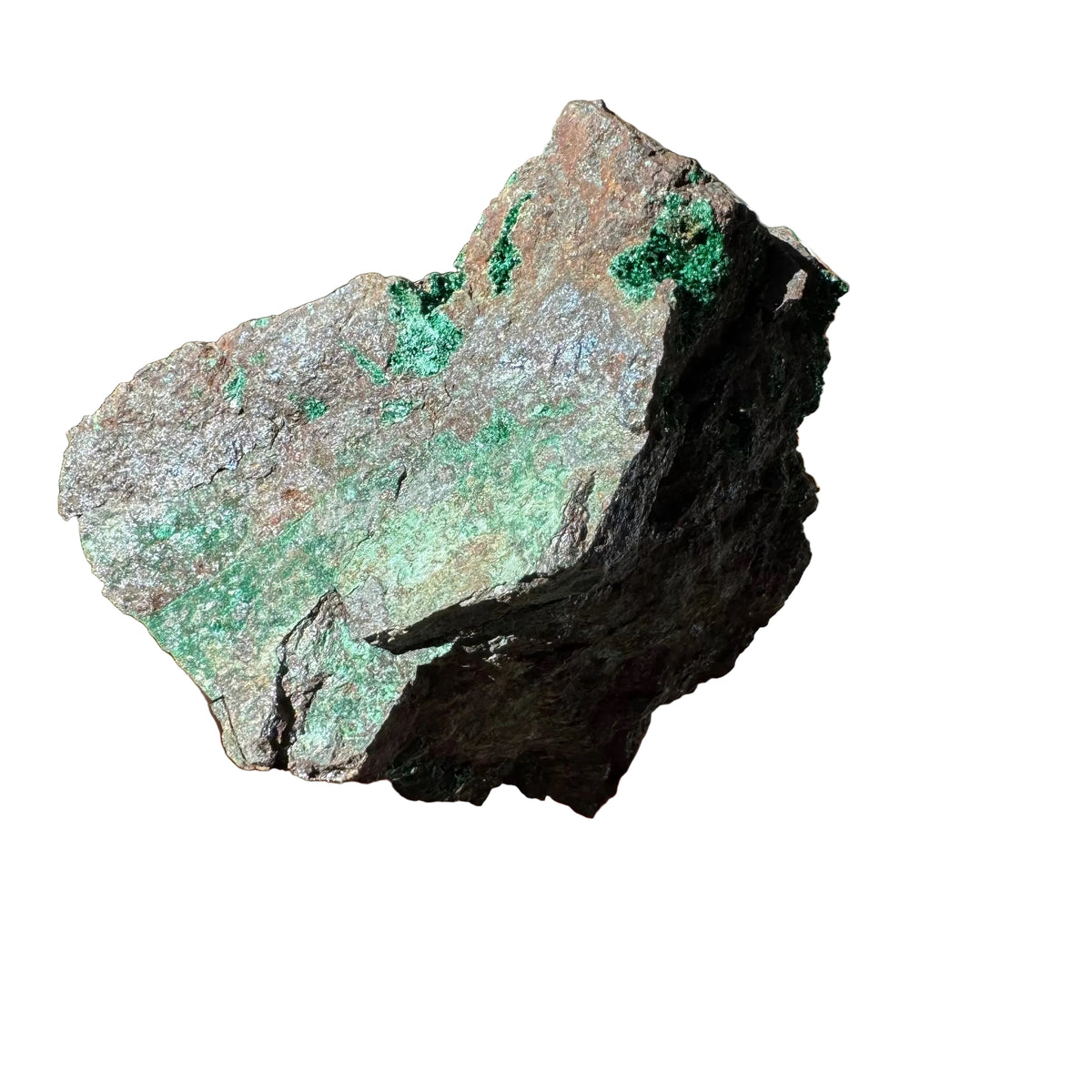 Other side of the brochantite specimen showing green crystal patches and a green-stained surface on gray-brown rock