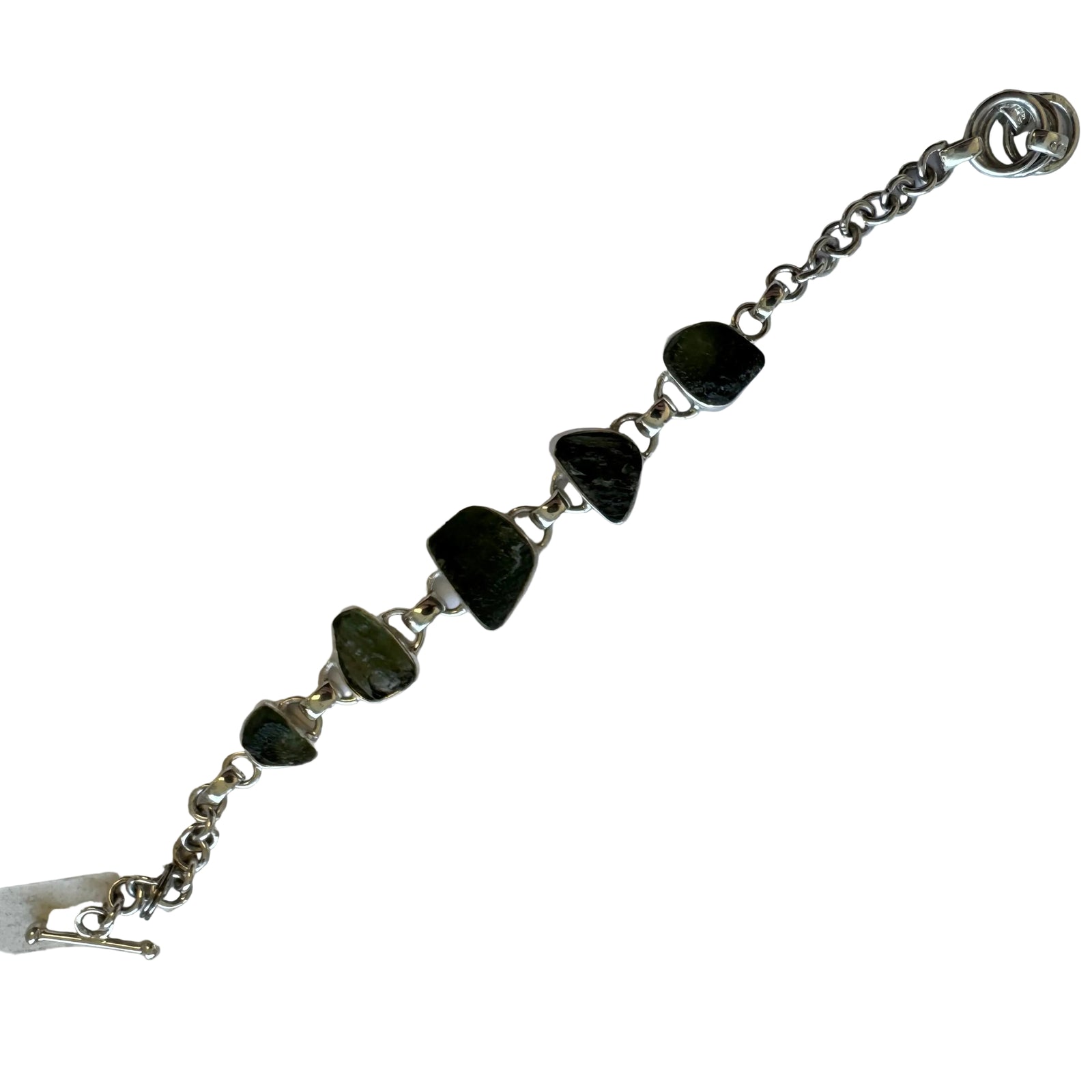 Silver bracelet with green stones on a white background