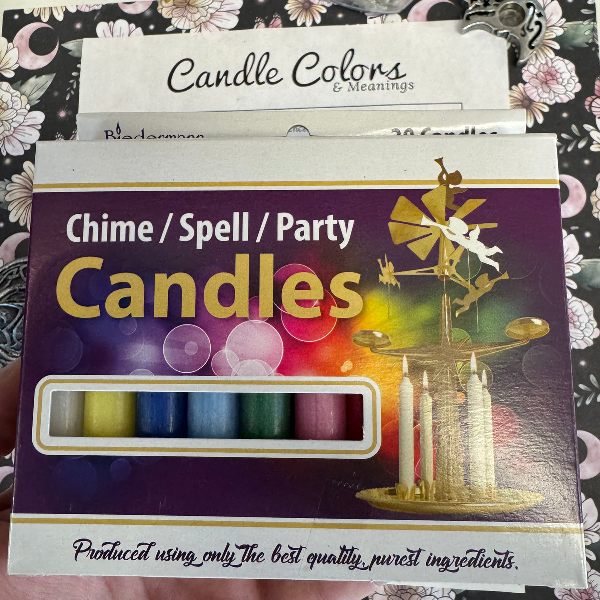 Box of Chime, Spell, Party Candles with colorful candles on a decorative background
