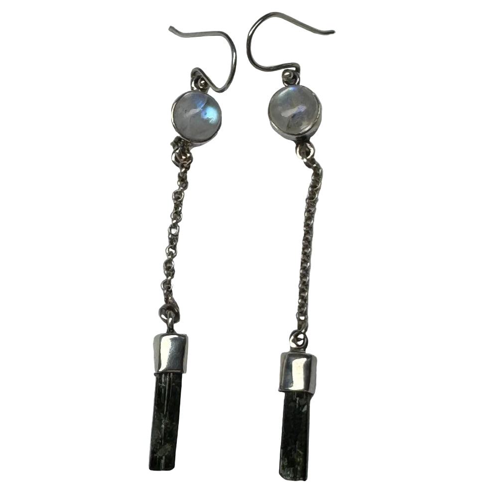 Pair of silver earrings with gemstones and chains on a white background
