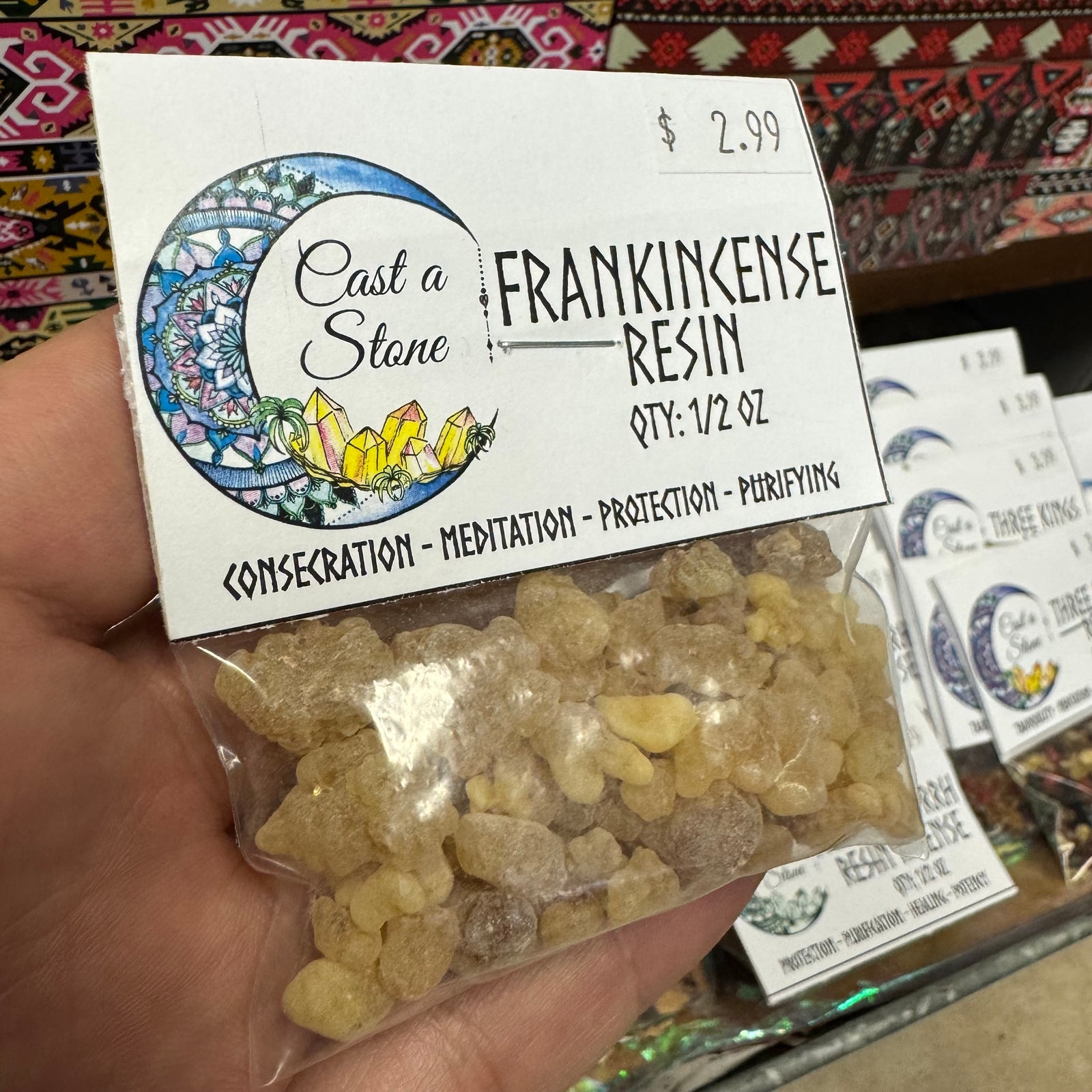 Packaged Frankincense Resin with 'Cast a Stone' label on a colorful background
