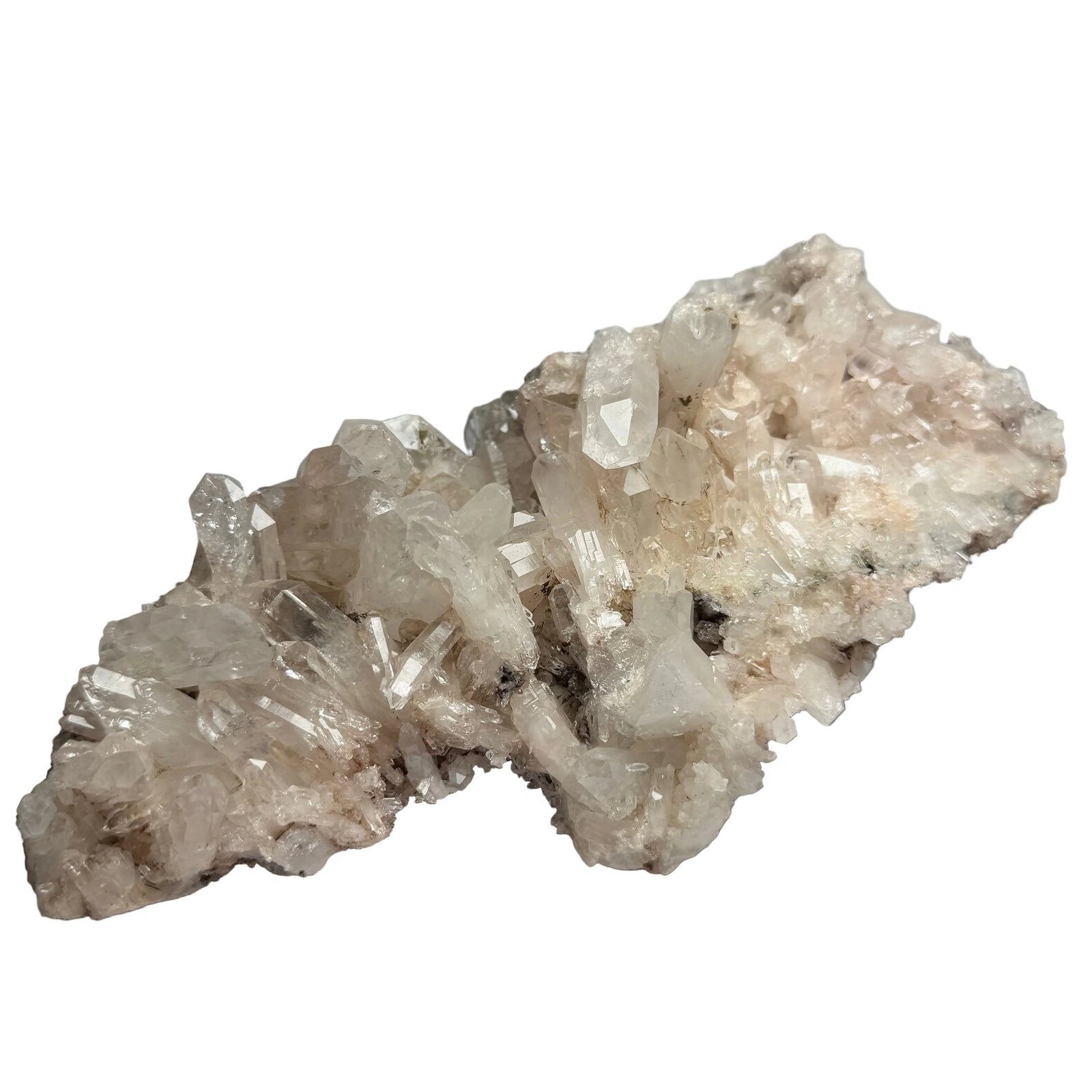 Crystal rock formation on a white surface with a blurred background