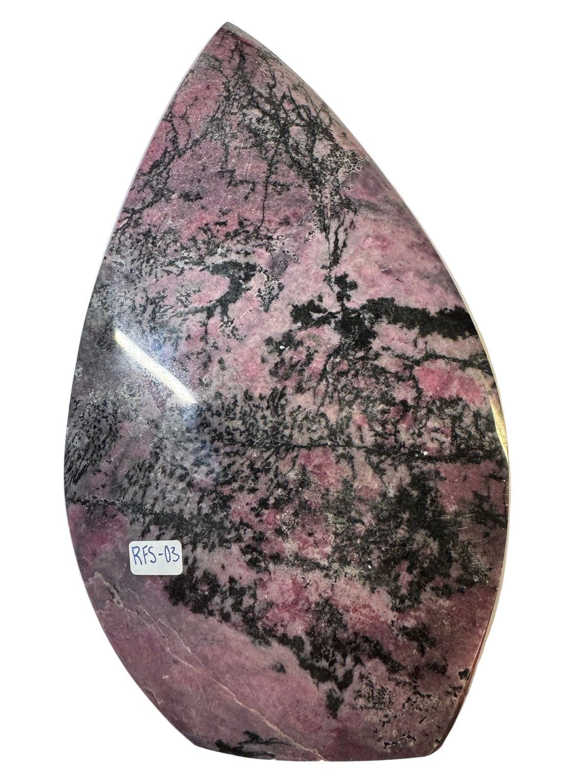Marble-patterned object with a label on a white surface