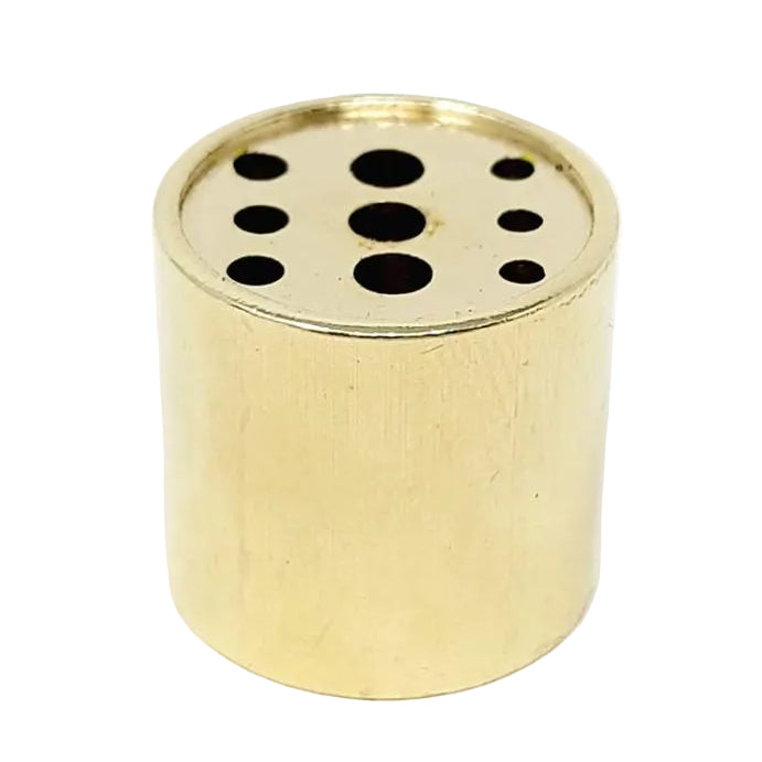 Gold cylindrical object with holes on a white background