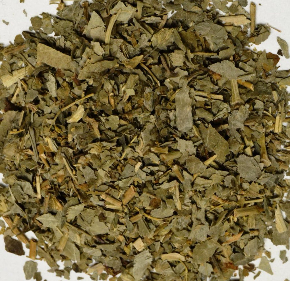 Dry herb or spice pile on a white background