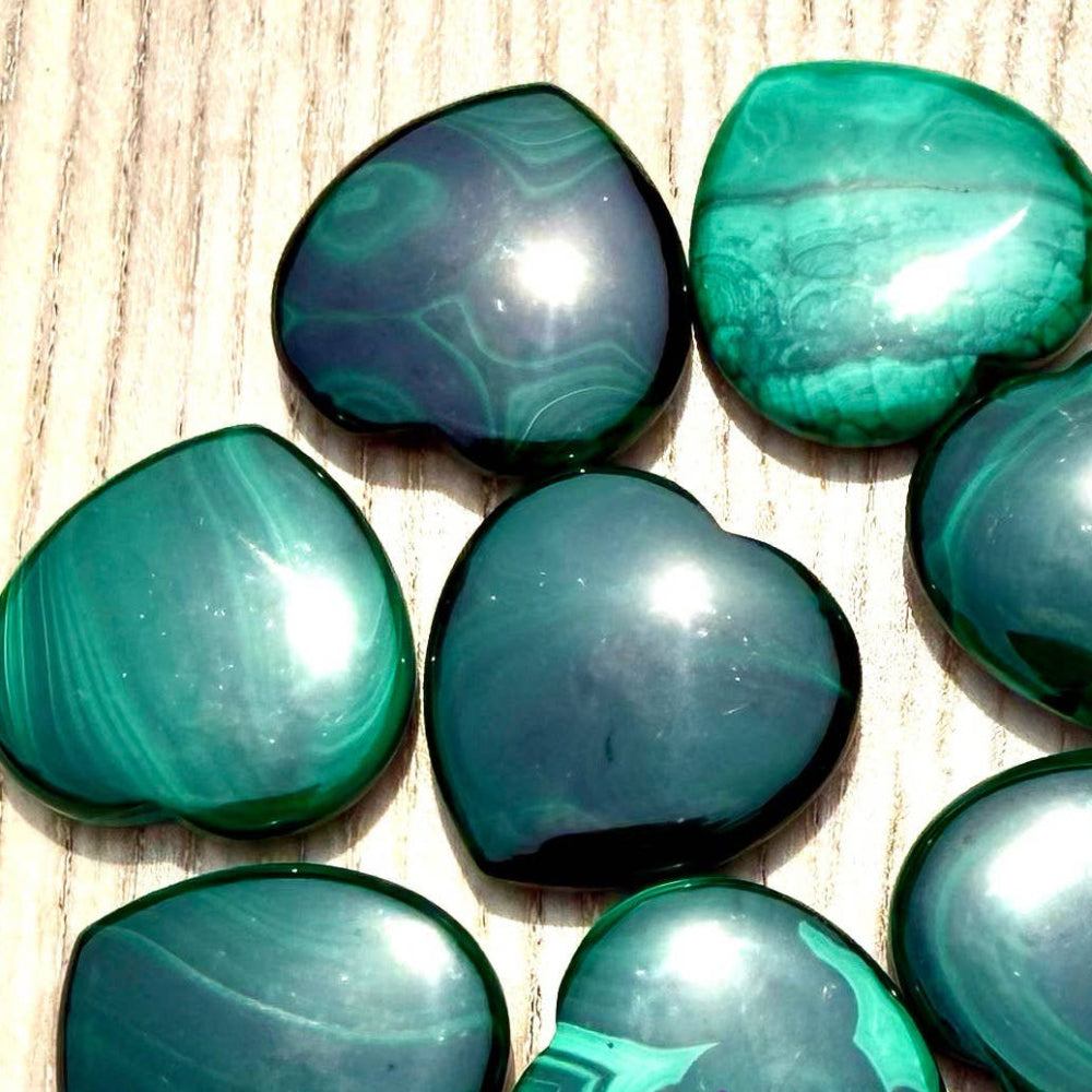 Green marbled stones on a textured surface