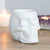 Made from ceramic with a matte white coating this chique skull burner will surely catch some eyes. Be you an avid collector of skulls, budding anatomist, wild witch, or king of the dead, simply place a tealight in this captivating cranium along with some of your favorite scents and enjoy the gentle flickering of candlelight and its drop-dead gorgeous scents from dusk till dawn.