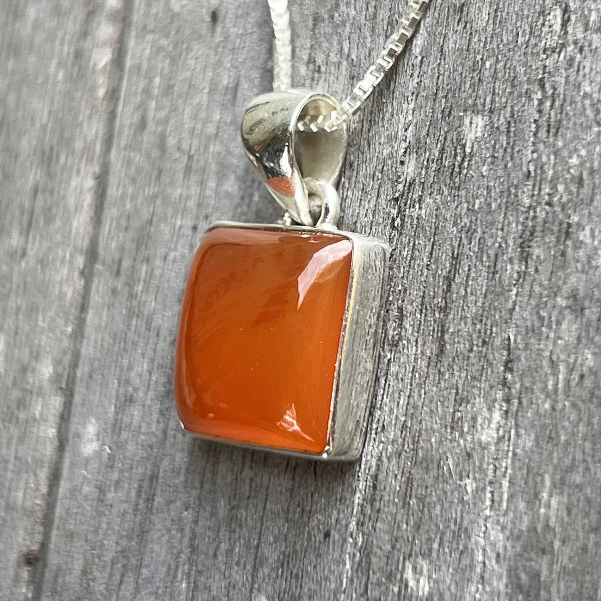 Carnelian is known as a stone of motivation and endurance, leadership and courage. Carnelians have protected and inspired throughout history. A glassy, translucent stone, Carnelian is an orange-colored variety of Chalcedony, a mineral of the Quartz family. 