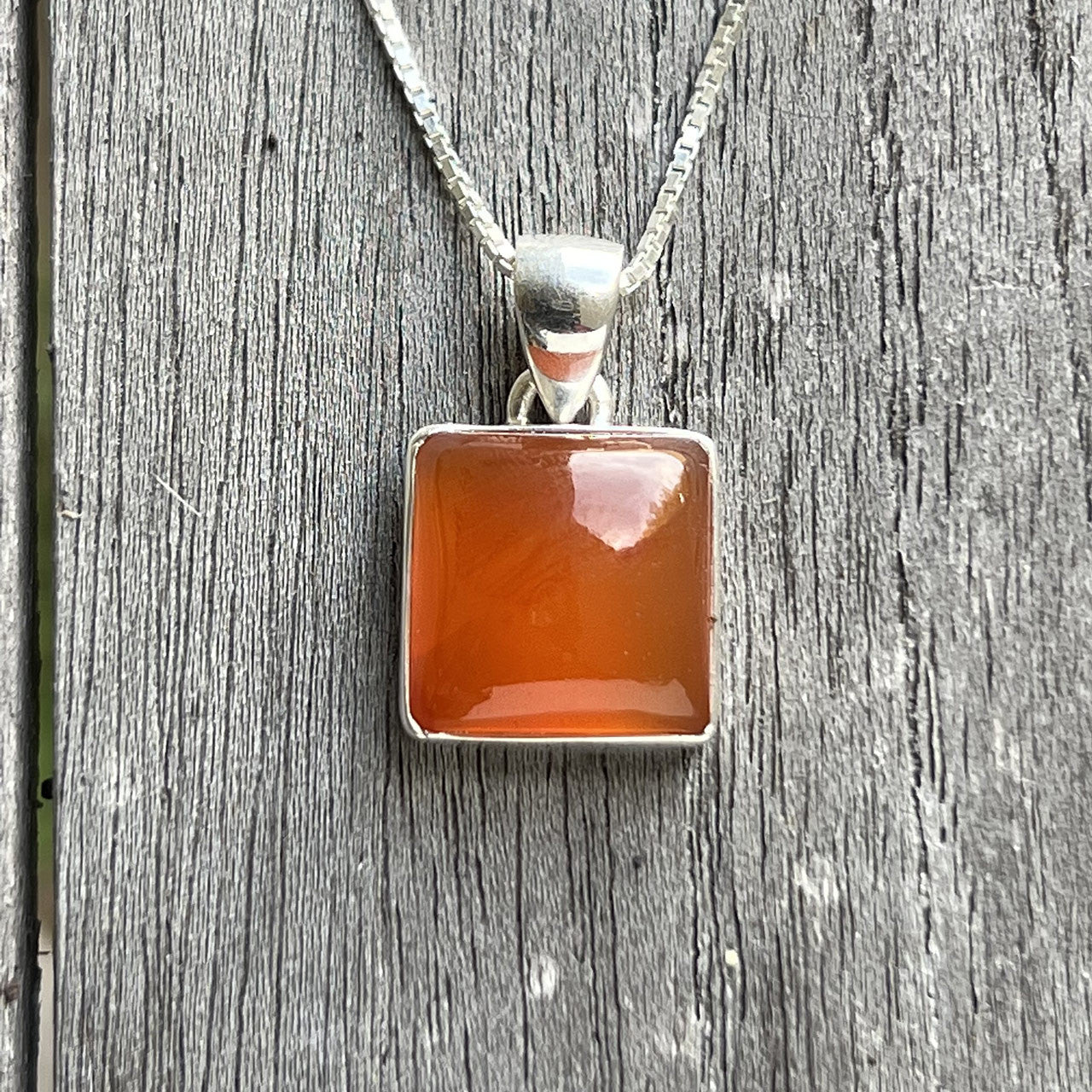 Carnelian is known as a stone of motivation and endurance, leadership and courage. Carnelians have protected and inspired throughout history. A glassy, translucent stone, Carnelian is an orange-colored variety of Chalcedony, a mineral of the Quartz family. 