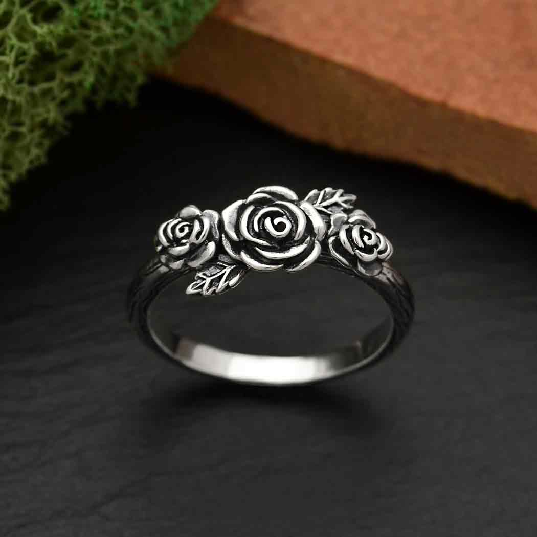 This sterling silver triple rose ring is a symbol of love, devotion, passion, and faith. Known for their beauty, roses are the perfect flower for marking romantic occasions, like anniversaries &amp; weddings, and even those smaller moments of affection that make each relationship unique. Like a lush, Kahlo-esque crown of roses, this triple rose ring has a distinct Latina-X feel. Combine with more flower and skull rings.