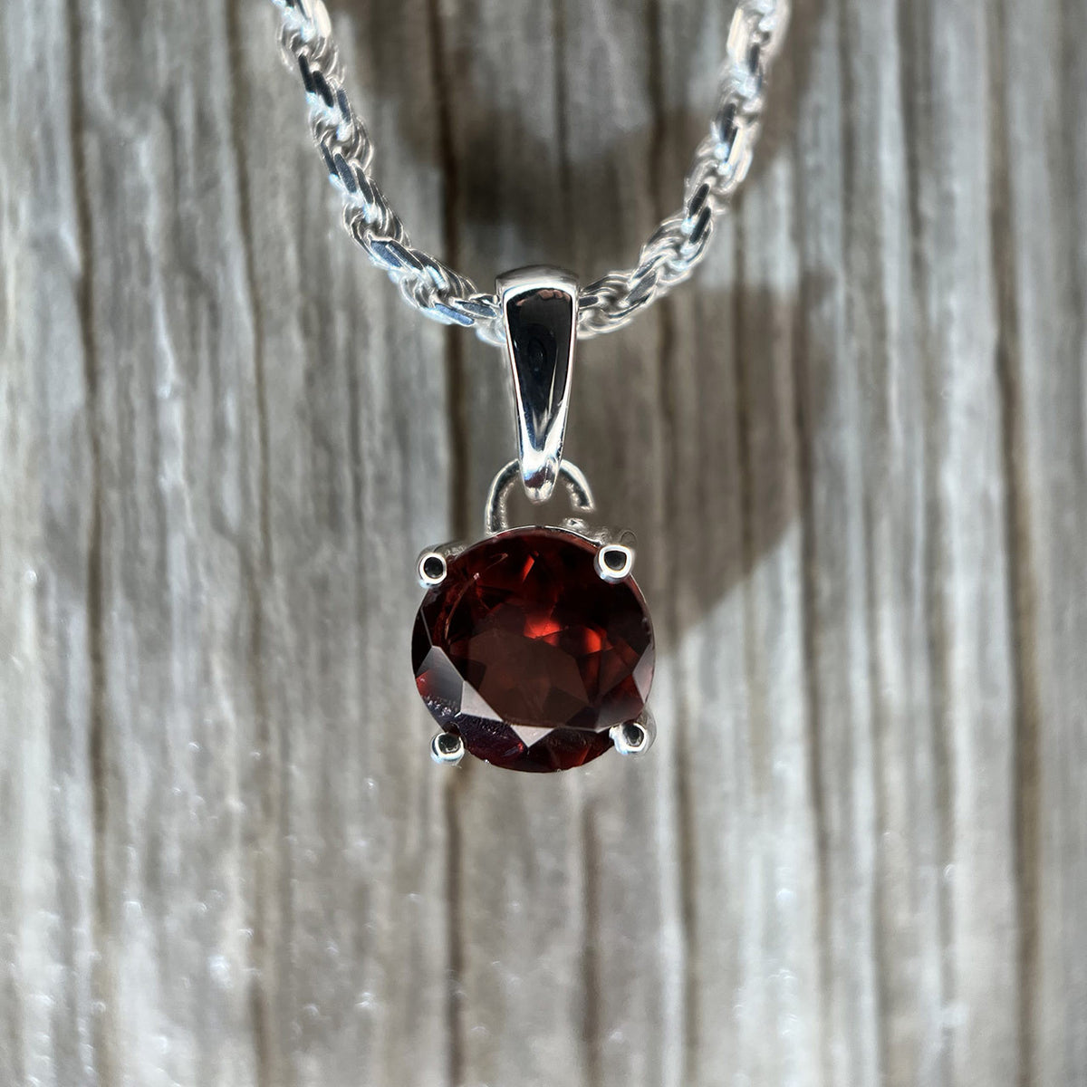 Garnet Circle Sterling Silver Pendant