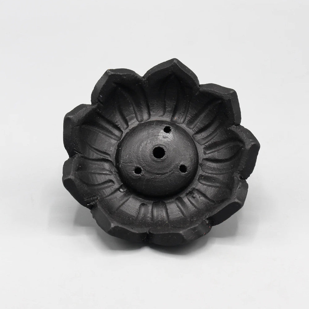 This incense holder is in the shape of lotus flower. This incense holder has a total of four holes-one slightly bigger than the other, in order to hold two different kinds of incense sticks. The beautifully crafted outer leaves and the design of the lotus is exquisite.