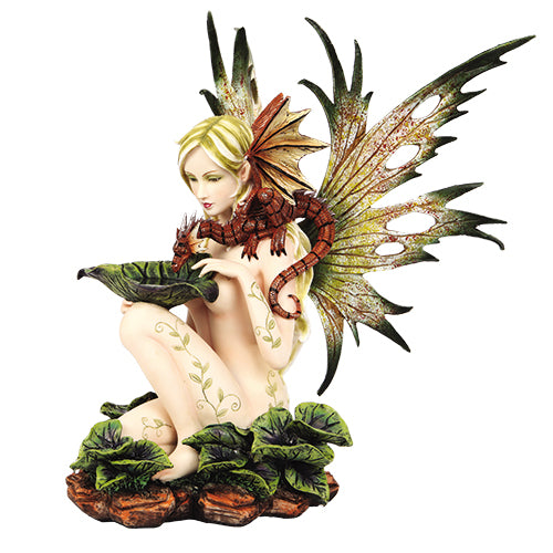 This Tribal Forest Fairy with Dragon Statue depicts one fairy doing just that, as she offers a drink to the dragon that perches on her shoulder. The fairy is adorned with leaf and vine tattoos while possessing leaf-like wings that extend from her back.