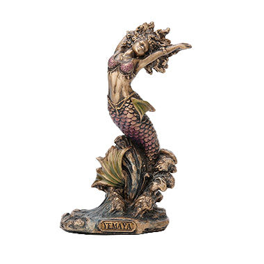 A bronze statue of Yemaya, the Orisha of the Ocean and Mother of All, sitting on a base with the name 'YEMAYA' inscribed.