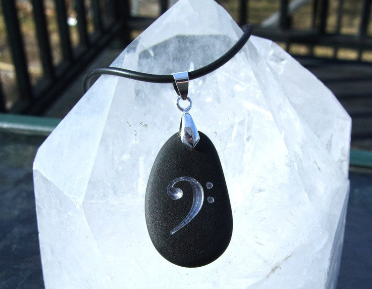 Musician's Bass Clef engraved in Silver on Black Sea Glass Pendant - Cast a Stone