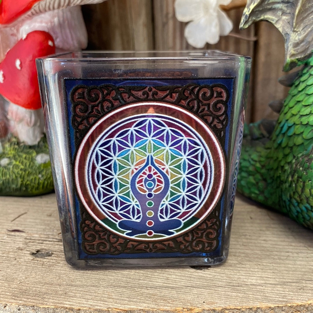 A beautiful square glass votive candle holder featuring a stained-glass like design and bright beautiful colours. Measures approximately 3&quot; high. Works with tealight or votive style candles.