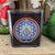 A beautiful square glass votive candle holder featuring a stained-glass like design and bright beautiful colours. Measures approximately 3" high. Works with tealight or votive style candles.