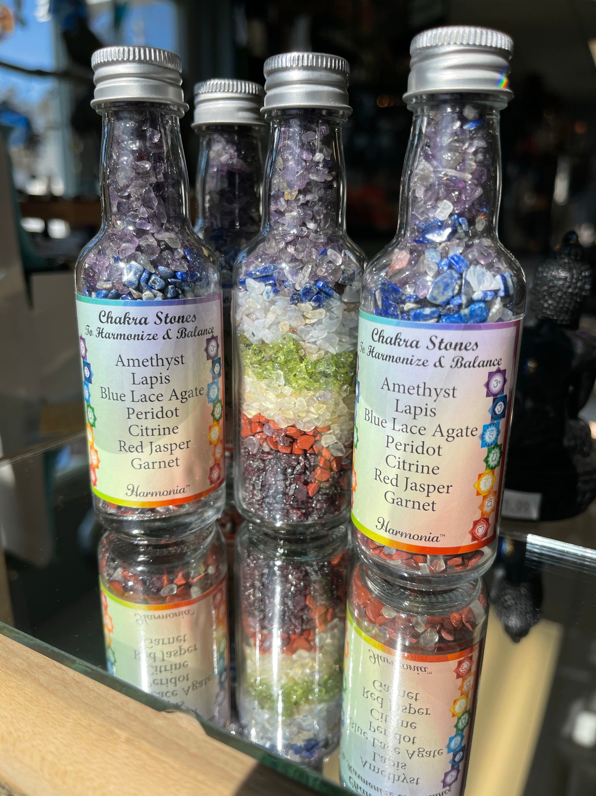 These bottles come with the following gemstones:  Amethyst Lapis Blue Lace Agate Peridot Citrine Red Jasper Garnet
