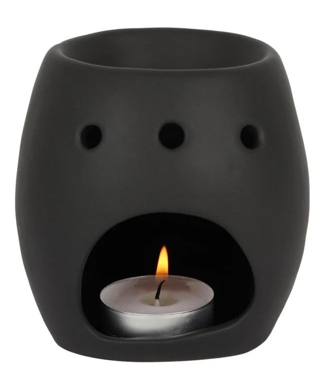 Made from ceramic with a matte black coating this chique skull burner will surely catch some eyes. Be you an avid collector of skulls, budding anatomist, wild witch, or king of the dead, simply place a tealight in this captivating cranium along with some of your favorite scents and enjoy the gentle flickering of candlelight and its drop-dead gorgeous scents from dusk till dawn.