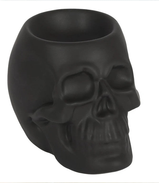 Made from ceramic with a matte black coating this chique skull burner will surely catch some eyes. Be you an avid collector of skulls, budding anatomist, wild witch, or king of the dead, simply place a tealight in this captivating cranium along with some of your favorite scents and enjoy the gentle flickering of candlelight and its drop-dead gorgeous scents from dusk till dawn.