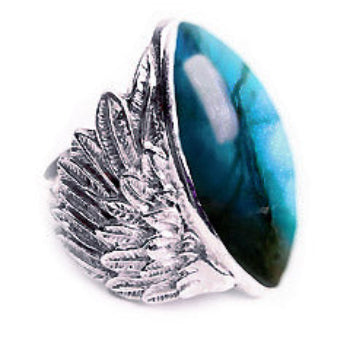Silver ring with a large blue stone on a white background